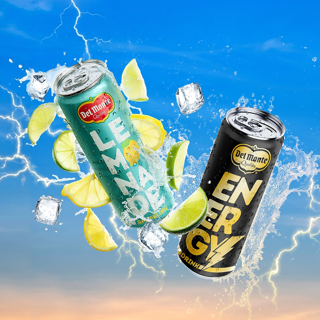 Two Del Monte 250ml cans—a lemon-lime lemonade drink and a black energy drink—floating with splashing water, ice cubes, citrus slices, and lightning in a bright blue background.